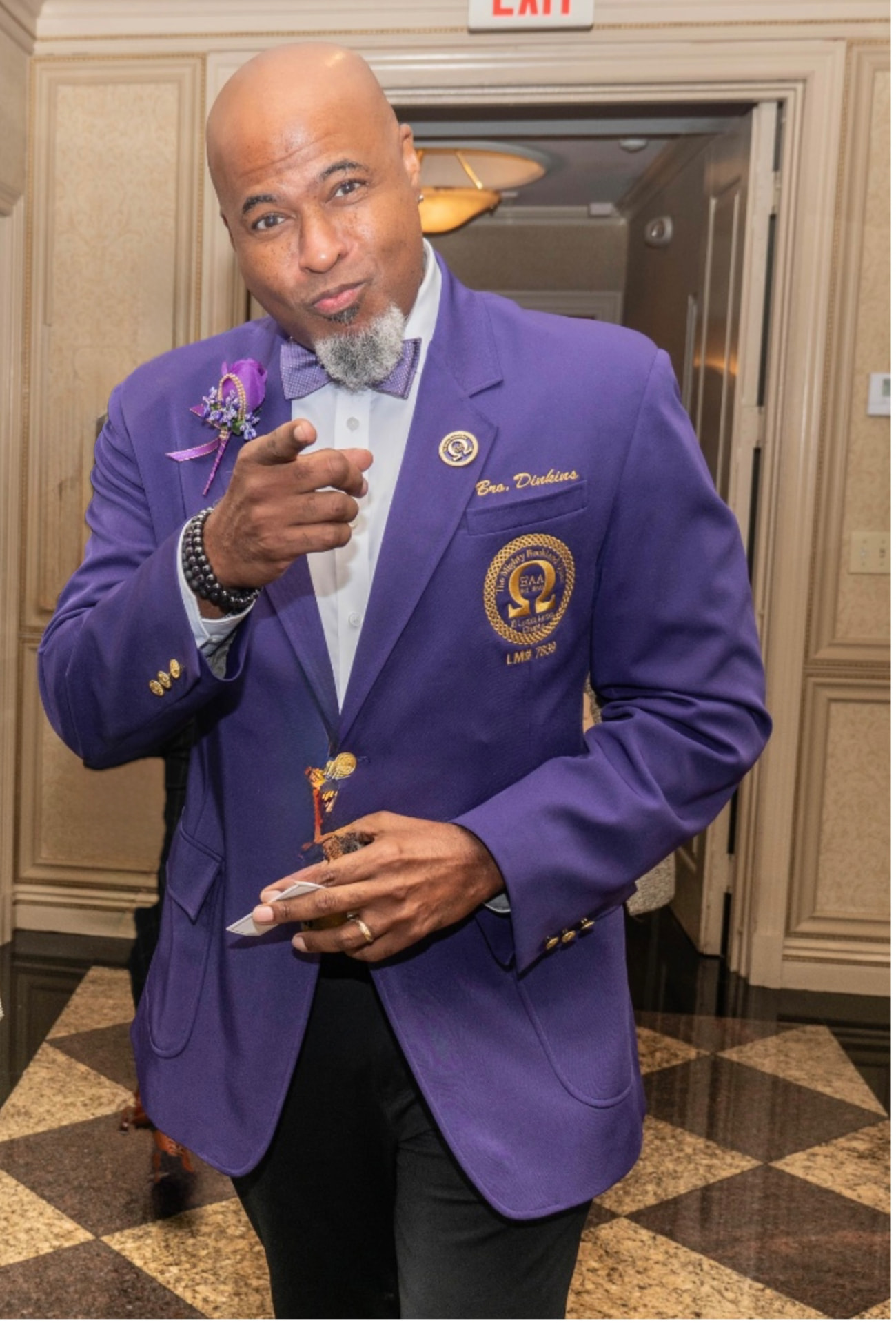 Brother Antonio “Tony” Dinkins in his purple Omega Psi Phi blazer